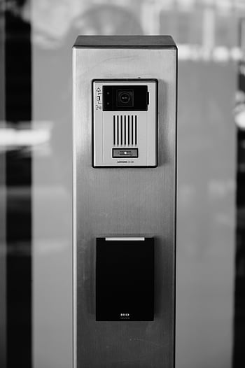 intercom system, building facade, minimalist photo, black and white, device on post, window reflection, Boise architecture, security device, HID card reader, Aiphone intercom, urban photography