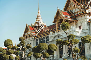Grand Palace, Bangkok, ornate architecture, trimmed trees, Thailand, stunning view, temple, historical site, cultural landmark, travel destination, Asian architecture