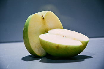 unripe apple, green apple, sliced apple, apple halves, fresh fruit, healthy food, green fruit, apple interior, apple core, apple slices, apple texture