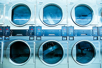 white front load washing machines, modern washing machines, launderette, contemporary laundry technology, front load washers, row of washing machines, laundry equipment, public laundry, coin-operated washing machines, laundry room, IPSO machines