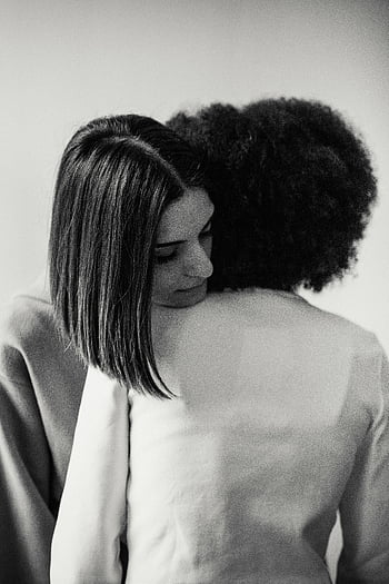 young women, hugging, after quarrel, black and white, two women, embracing, warmth, friendship, emotional connection, monochrome, affectionate moment
