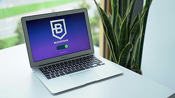 gray laptop, blockchain interface, cryptocurrency topics, modern laptop, desk, blockchain technology, digital currency, crypto trading, tech workspace, office setup, financial technology