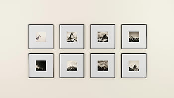 assorted paintings, framed mountain photography, minimalist display, plain wall, framed art, mountain images, wall art, black and white photography, minimalist art, framed prints, wall decor