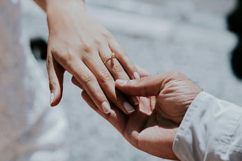 wedding ring, newlywed couple, elegant bride, groom, holding hands, outdoors, love, commitment, daylight, romantic, couple