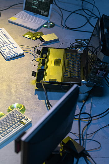 laptop computers, wires, cyberpunk setup, retro tech, dim room, keyboards, floppy disks, computer monitors, tech items, computer setup, vintage technology