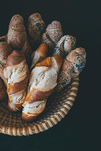artisan bread, freshly baked, baguettes, bakery, baked goods, top view, wicker basket, sesame seeds, poppy seeds, gourmet, rustic