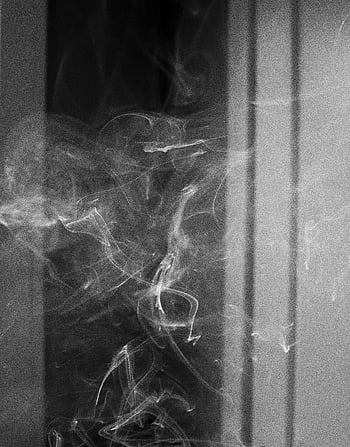 cigarette smoke, dark room, black and white, swirling smoke, atmospheric image, indoors, mysterious, elegant, smoke photography, indoor smoke, black and white photography