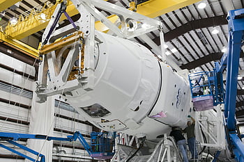 spacecraft assembly, modern spacecraft, industrial facility, high-tech equipment, technicians working, spacecraft construction, factory assembly, aerospace manufacturing, space technology, industrial manufacturing, spacecraft production
