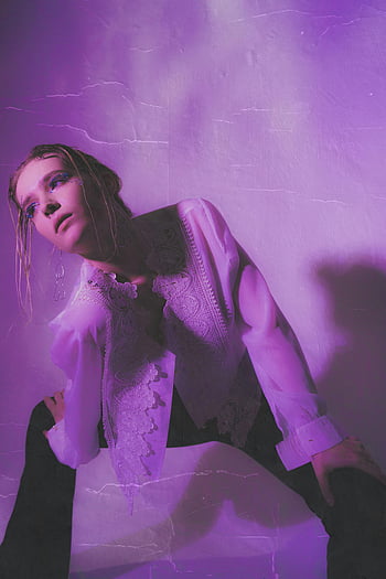 thoughtful young woman, neon room, neon purple light, stylish young woman, elegance, modernity, indoors, posing, lace blouse, purple lighting, fashion photography