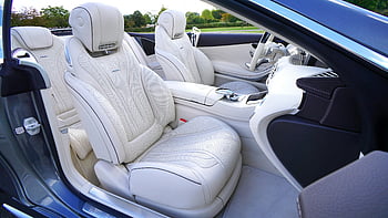 white leather car seats, luxury car interior, pristine white leather, advanced design features, car bucket seats, elegant car seats, white leather seats, car interior design, luxury vehicle seats, car seating comfort, white leather upholstery