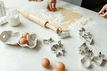 baking, dough, rolling pin, cookie cutters, homemade cookies, kitchen counter, eggs, flour, preparing dough, baking tools, baking process