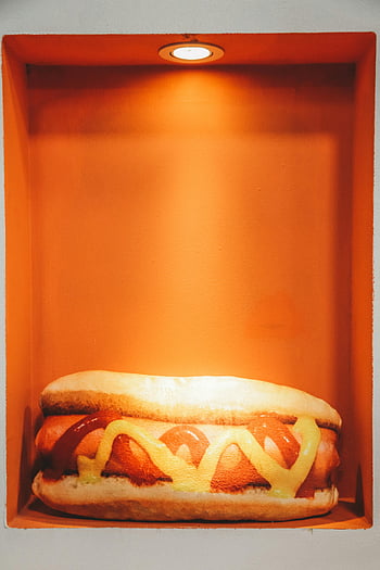 sausage sandwich, hotdog model, mustard, ketchup, warm orange lighting, close-up, tasty, box, food photography, sandwich in box, hot dog