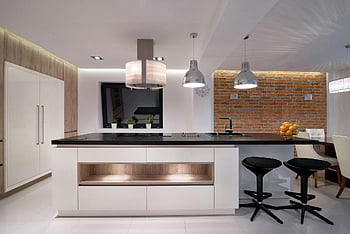 silver pendant lamp, white painted ceiling, modern kitchen, black countertop, brick wall, white cabinets, black stools, interior design, contemporary lighting, minimalist decor, kitchen island
