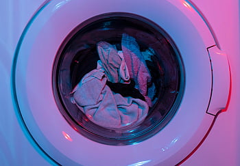 clothes in washing machine, colorful washing machine, vivid purple lights, vivid blue lights, laundry, washing machine interior, laundry machine, laundry cycle, laundry room, laundry appliance, laundry equipment