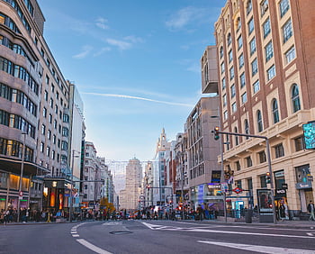 Calle Gran Via, Madrid, bustling street scene, iconic Gran Vía, entertainment hub, urban architecture, cityscape, busy street, famous street, city life, street view