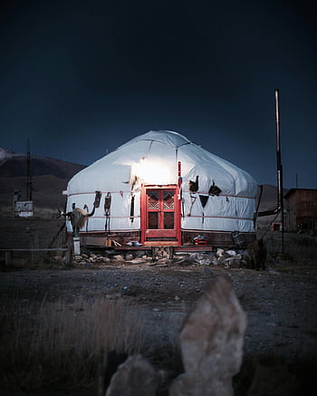 White Yurt, Altai Mountains, traditional yurt, red door, night sky, mountain landscape, nomadic dwelling, cultural shelter, outdoor living, remote location, illuminated yurt
