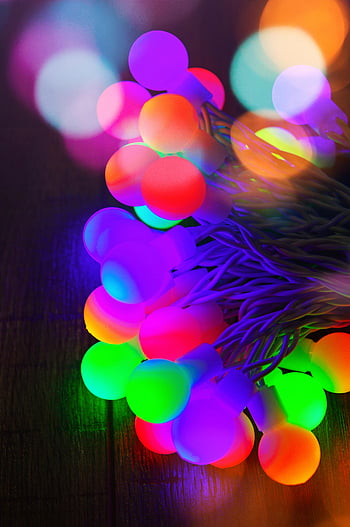 multicolored LED string lights, glowing lights, bokeh effect, close-up view, multi-colored lights, LED lights, string lights, colorful lights, bokeh lights, decorative lights, festive lights