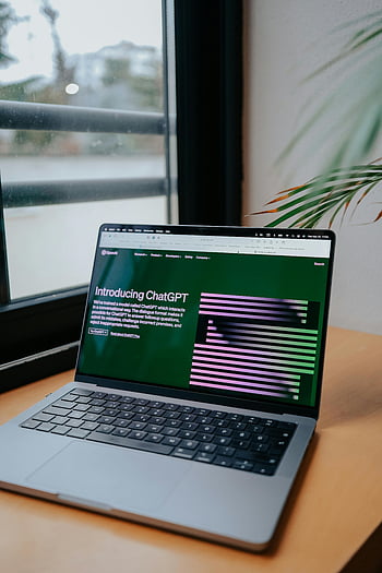 laptop, ChatGPT, site, desk, window, modern technology, computer screen, interface, indoor setting, technology display, workspace