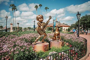 Disney World, flowerbed, statues, golden character, guitar, dog, vibrant flowers, theme park, Disney, outdoor, sculpture