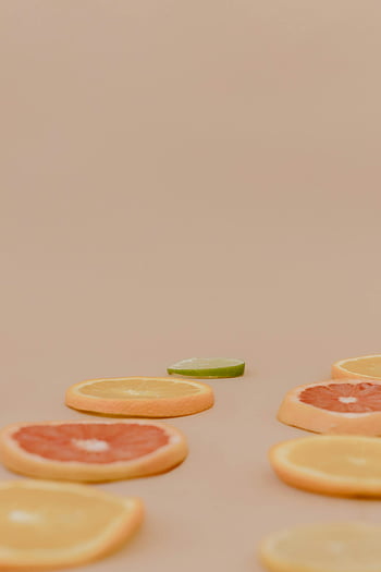 citrus fruits, sliced oranges, grapefruits, artistic arrangement, copy space, fruit slices, orange slices, grapefruit slices, citrus slices, minimalistic design, food photography