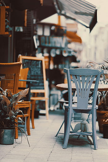 outdoor cafe, vintage chairs, cozy tables, sunny street, relaxing spot, cafe tables, outdoor seating, vintage furniture, street cafe, cozy cafe, cafe chairs