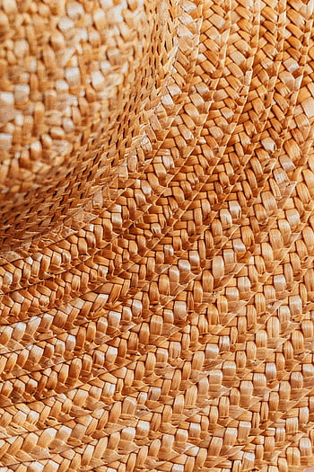 wicker patterns, woven straw, textured surface, intricate patterns, close-up view, detailed texture, wicker texture, straw weaving, woven texture, wicker weave, straw patterns