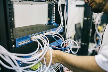 electronics engineer, fixing cables, server, IT professional, configuring network cables, server rack, Ethernet connections, network setup, data center, technical support, cable management