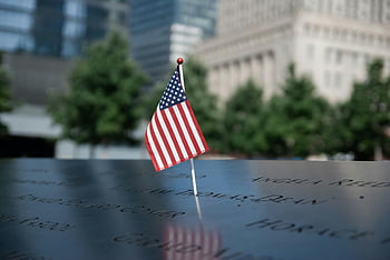 American flag, 9/11 Memorial, NYC, remembrance, patriotism, memorial site, New York City, September 11, tribute, flag, reflection