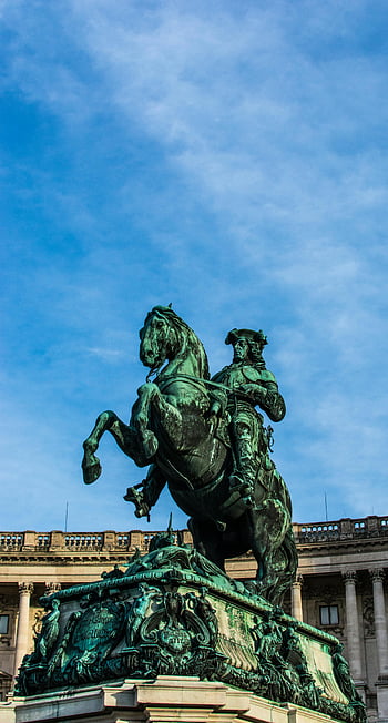 equestrian statue, Prince Eugene of Savoy, Vienna, blue sky, dramatic view, horse statue, historical monument, outdoor sculpture, clear sky, European art, bronze statue