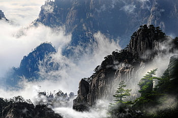 Huangshan, misty mountains, mountain peaks, foggy landscape, serene scenery, dramatic landscape, China mountains, natural beauty, mountain mist, mountain view, scenic mountains