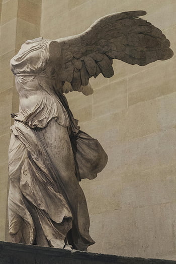 Winged Victory of Samothrace, Louvre Museum, Paris, France, iconic sculpture, ancient statue, art history, classical art, marble statue, winged figure, museum exhibit