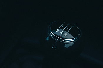 gear shift lever, closeup photography, vehicle gear shift, gear stick, car interior, manual transmission, gear selector, automotive parts, car controls, shift knob, gear pattern