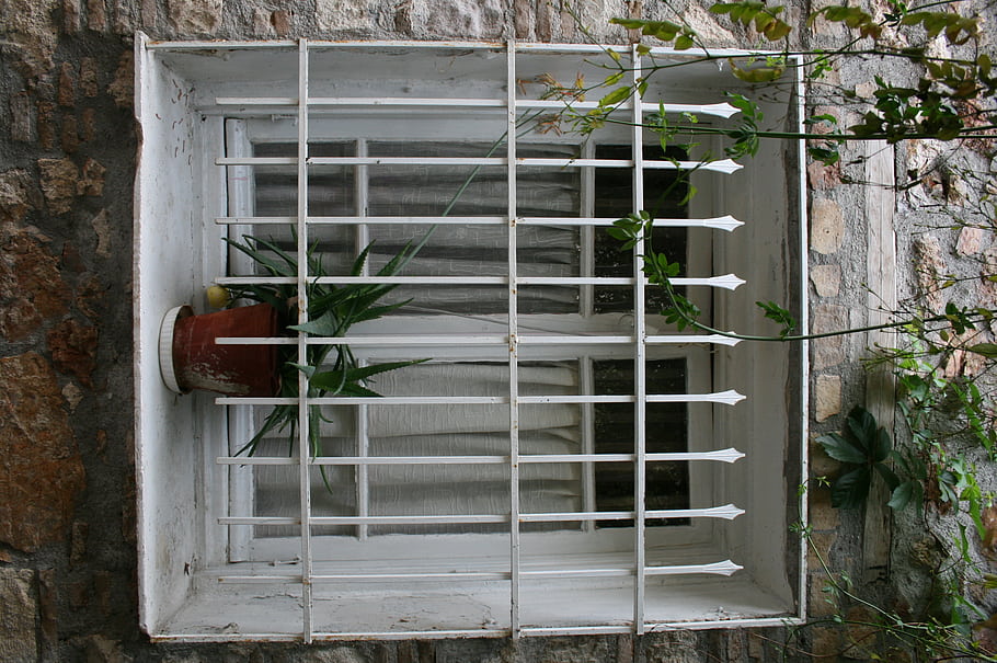 Metaxourgeio, Athens, Greece, window, metal bars, plant, stone wall, urban, art district, street scene, Metaxourgio