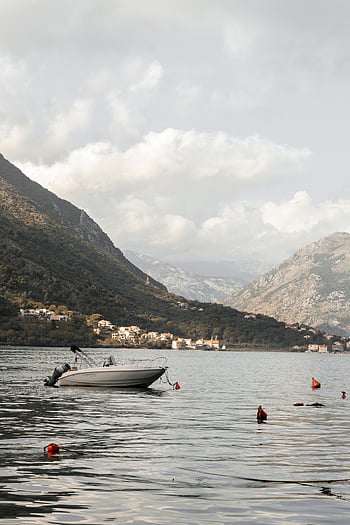 Kotor Bay, Montenegro, serene scene, boat, picturesque mountains, sea view, calm waters, coastal landscape, natural beauty, travel destination, outdoor scenery
