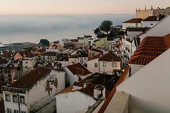 cityscape, old buildings, evening, European village, twilight, red-tiled rooftops, colorful buildings, captivating view, village scene, architectural charm, historic town
