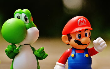 Super Mario, Yoshi, plastic figure, video game franchise, detailed close-up, Mario figurine, Yoshi figurine, popular video game, Mario and Yoshi, toy figure, gaming collectible