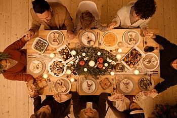 family praying, Christmas dinner, festive celebration, beautifully set table, top view, family gathering, holiday meal, Christmas table setting, festive dinner, family dinner, Christmas celebration