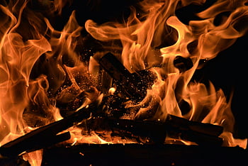 bonfire wallpaper, roaring flames, glowing embers, warm backgrounds, vivid backgrounds, close-up flames, radiant heat, radiant light, fire wallpaper, bonfire flames, bonfire embers