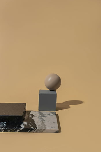 sphere object, block, geometric shapes, minimalist studio, warm beige background, abstract composition, 3D rendering, modern art, simple design, balance, shadow play