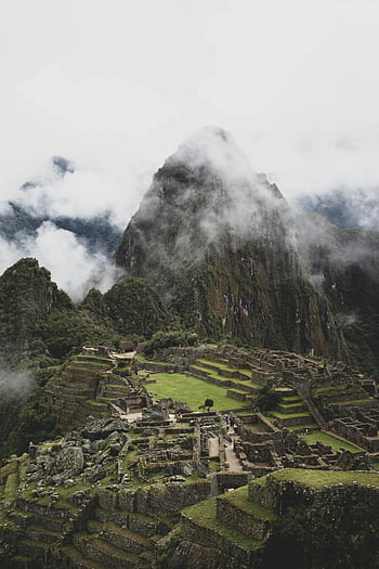 Machu Picchu, clouds, aerial view, ancient Inca architecture, mountain ruins, Peru, Inca civilization, historical site, natural wonder, travel destination, scenic landscape