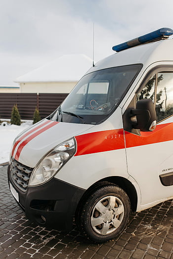 ambulance, parked ambulance, red and white ambulance, outdoor parking, daytime photo, emergency vehicle, close-up vehicle, medical transport, rescue vehicle, ambulance service, emergency response