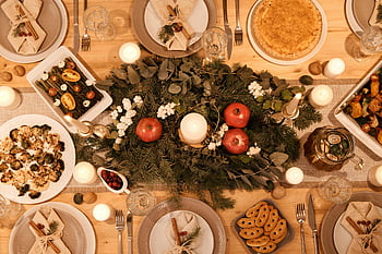 Christmas dinner table, top view, festive dishes, holiday dinner, Christmas centerpiece, candles, decorated table, festive table setting, Christmas table, holiday table, dinner table setup