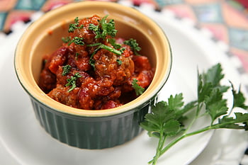 meat dish, chili dish, homemade chili, fresh parsley, cozy meal, flavorful dish, garnished chili, close-up food, homemade meal, parsley garnish, chili garnish