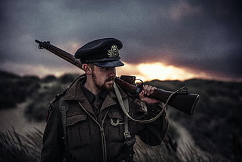 soldier, uniform, rifle, dramatic sunset, close-up photography, military, outdoor, historical, vintage, nature, landscape