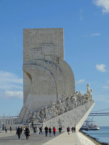 Padrão dos Descobrimentos, Lisbon, Portugal, tourists, iconic monument, clear blue sky, visitors, historic site, outdoor attraction, cultural landmark, river view