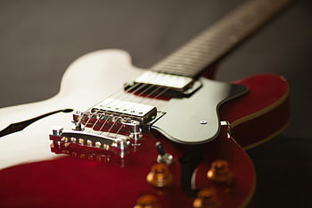 red electric guitar, detailed close-up, guitar bridge, guitar strings, musical instrument, red guitar, electric guitar details, guitar close-up, guitar hardware, guitar body, guitar neck