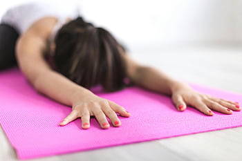 woman exercising, yoga mat, pink yoga mat, stretching, relaxation, mindfulness, close-up, woman stretching, exercise, fitness, wellness