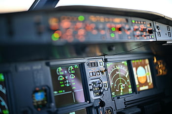 airplane cockpit, dashboard, digital displays, close-up view, instrumentation, modern technology, flight controls, aviation equipment, pilot view, aircraft interior, cockpit panel