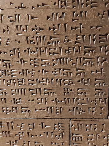 冠状彫刻、 古代の碑文、 石の表面、 閉じる、 冠状スクリプト、 歴史的遺物、 古文、 考古学的発見、 古代の粘液、 石の彫刻、 古代史