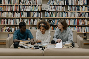 people studying, group study session, students, bookshelves, library, books, study group, education, learning, collaboration, academic